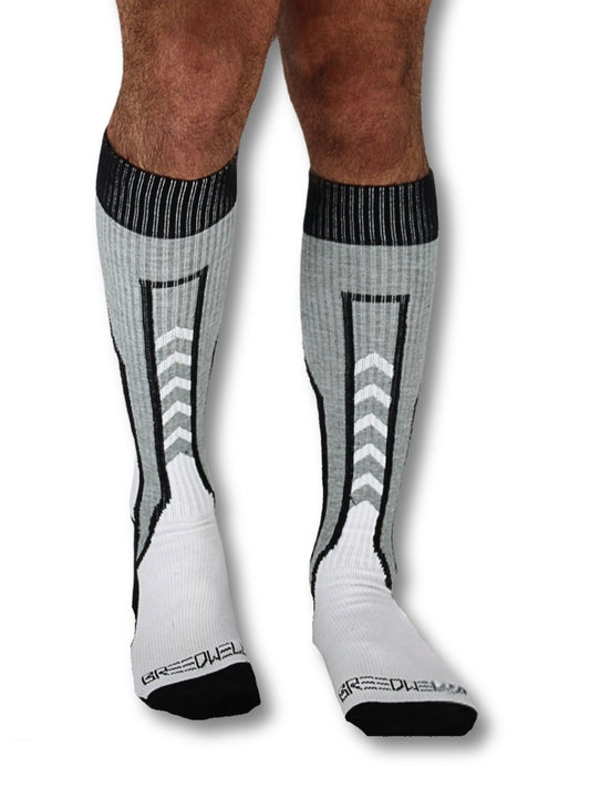 White knee-high socks with black and gray patterns worn by a person on a white background