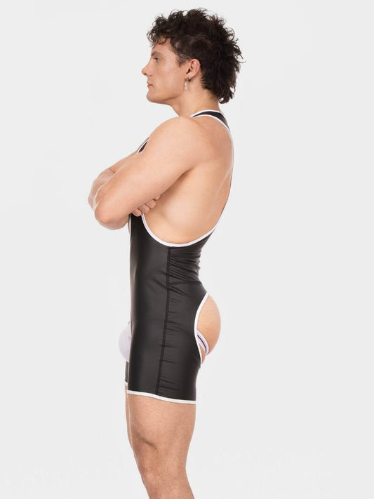 Person wearing a black and white swimsuit on a light gray background