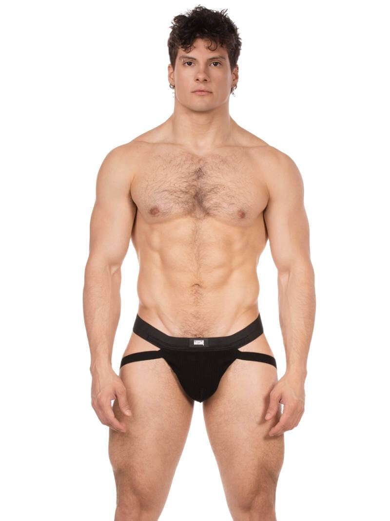 Man wearing a black men's jockstrap on a white background