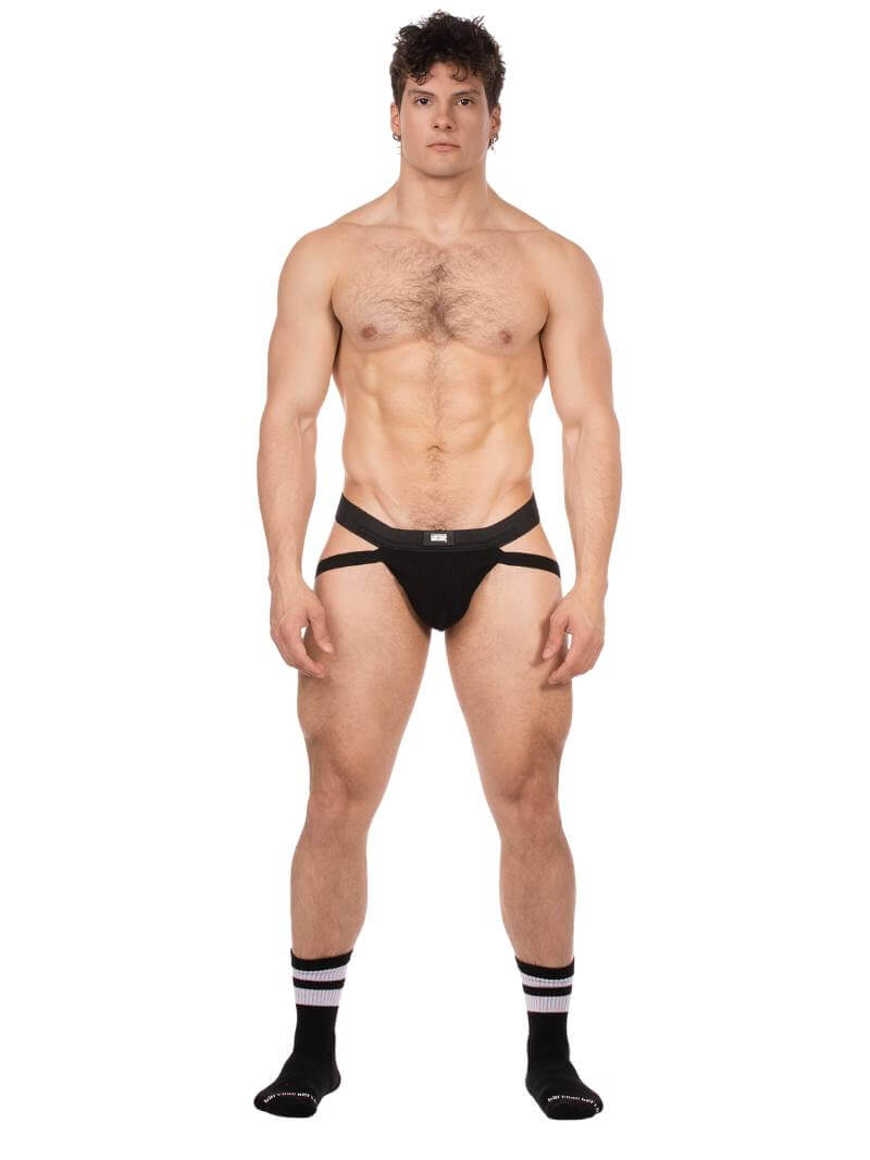 Man wearing a black men's gay jockstrap on a white background