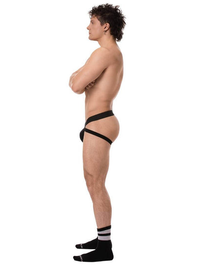 Man wearing a black men's jockstrap on a white background