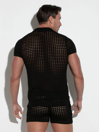 Man wearing a black mesh outfit on a white background
