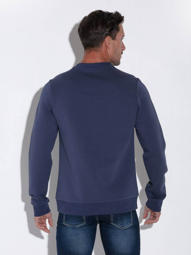 Man wearing a navy blue sweatshirt against a white background