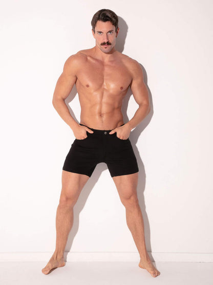 Man wearing black shorts on a white background