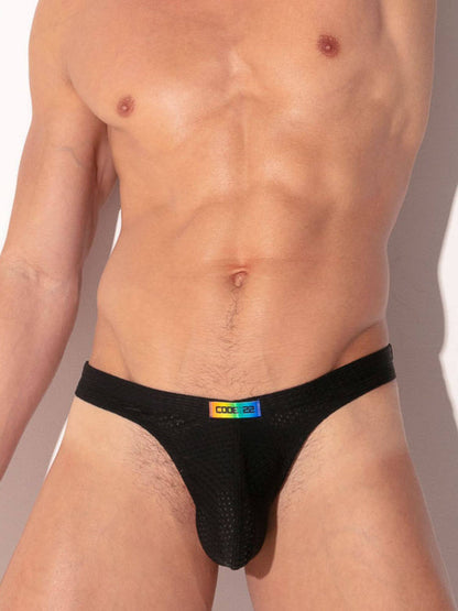 Black men's underwear with a rainbow label on a neutral background
