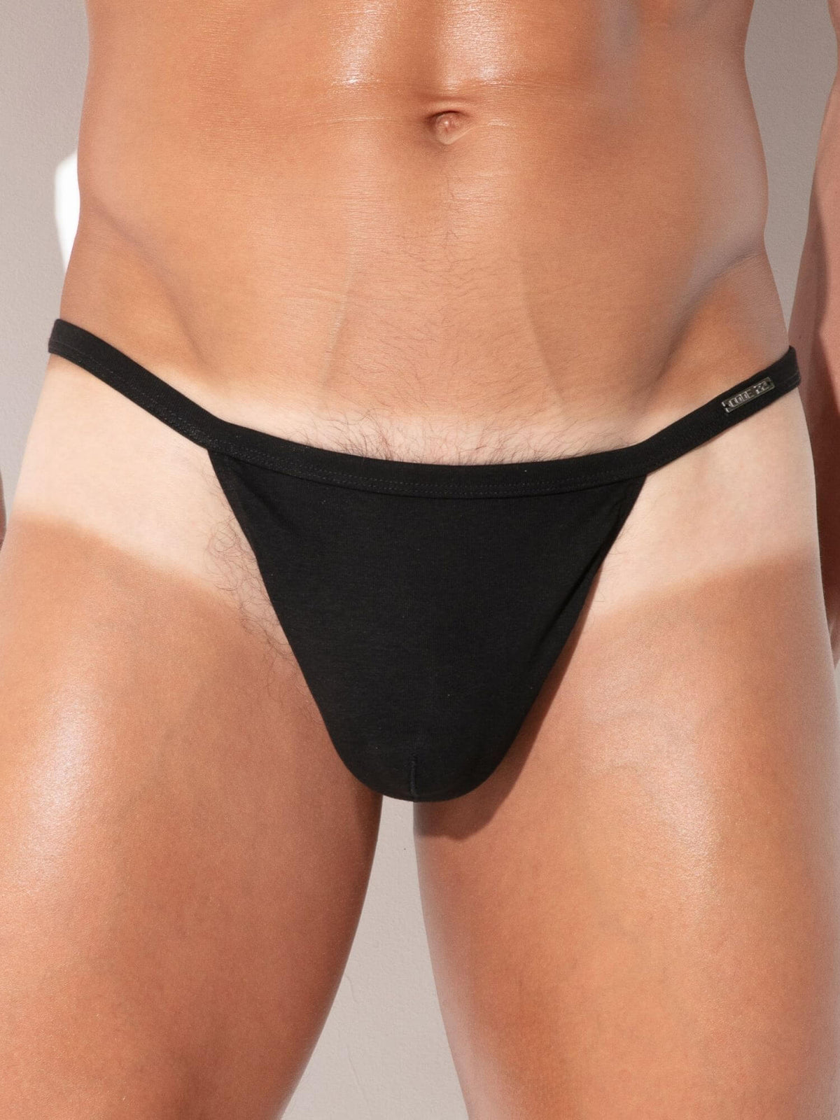 Close-up detail of CODE 22 Pure String men's underwear in black