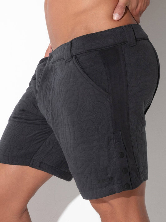 Close-up detail of CODE 22 Quilted Snap-Detail Shorts in charcoal