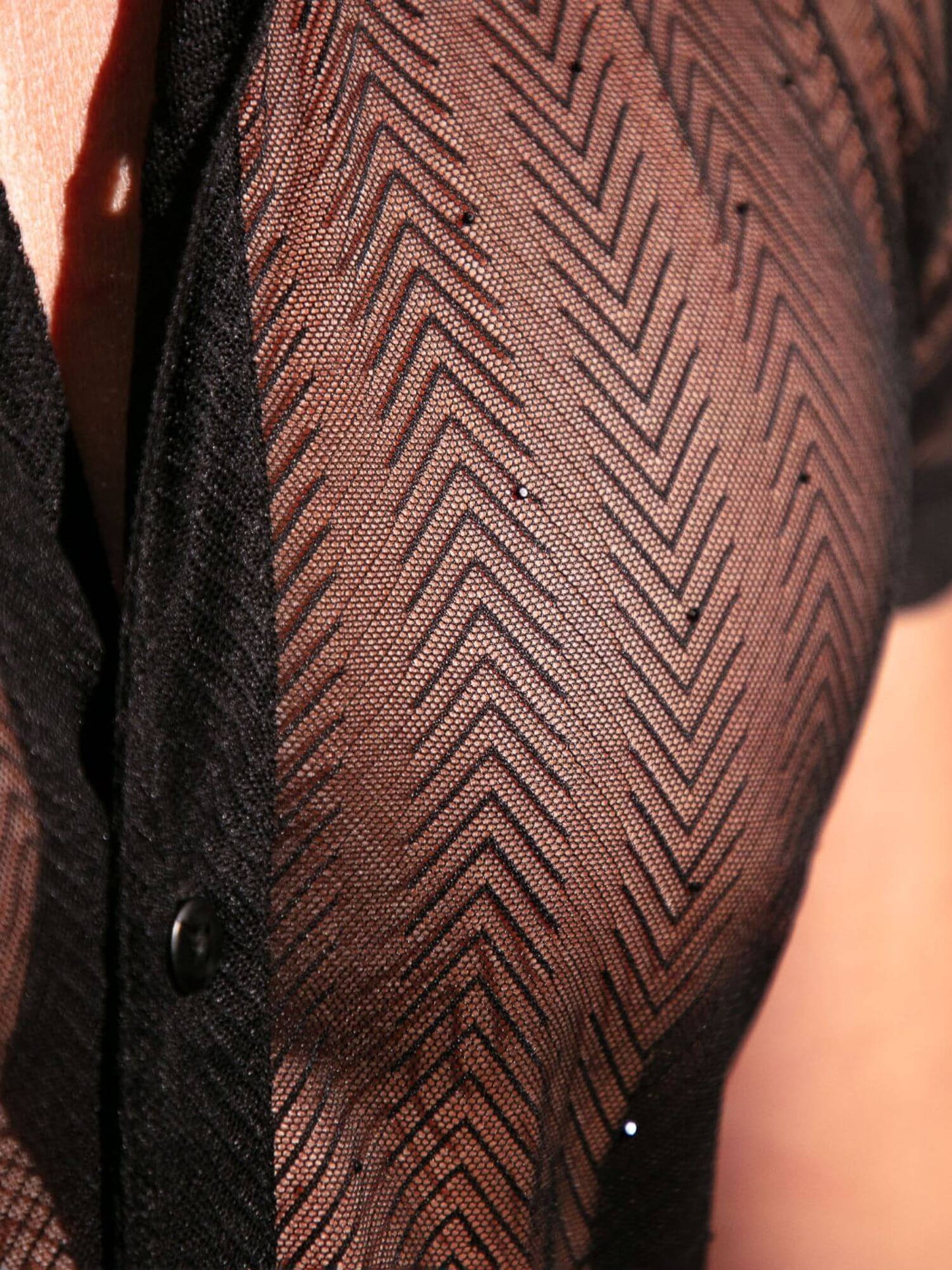 Close-up of a textured brown fabric with a zigzag pattern.