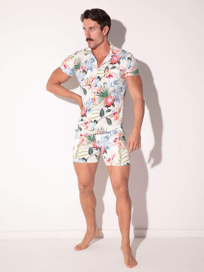 Man wearing a floral outfit set on a white background