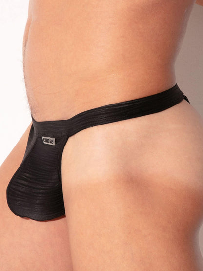 Black men's underwear with brand logo on a neutral background