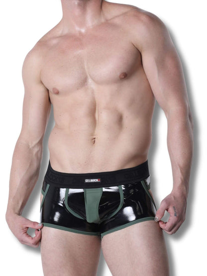 Man wearing black and green underwear on a white background