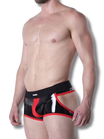 Man wearing black and red boxer briefs on a white background