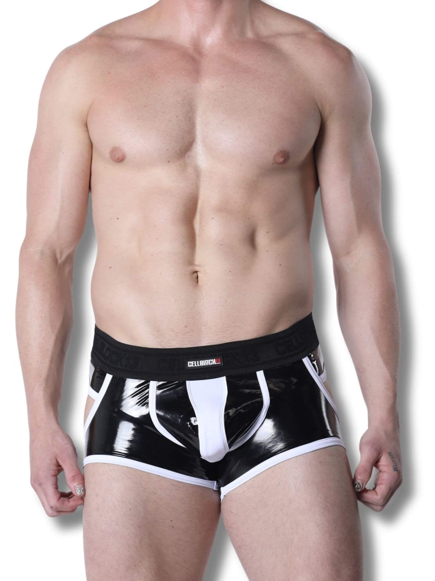 Man wearing black and white jock trunk on a plain background