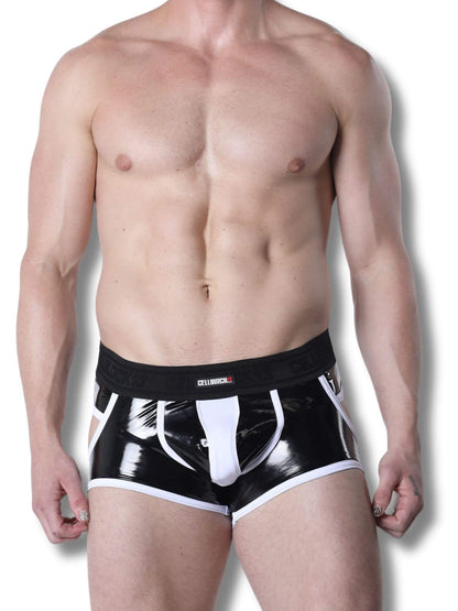 Man wearing black and white jock trunk on a plain background