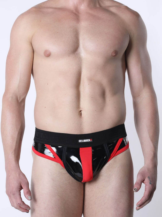 Man wearing a shiny black and red thong on a white background