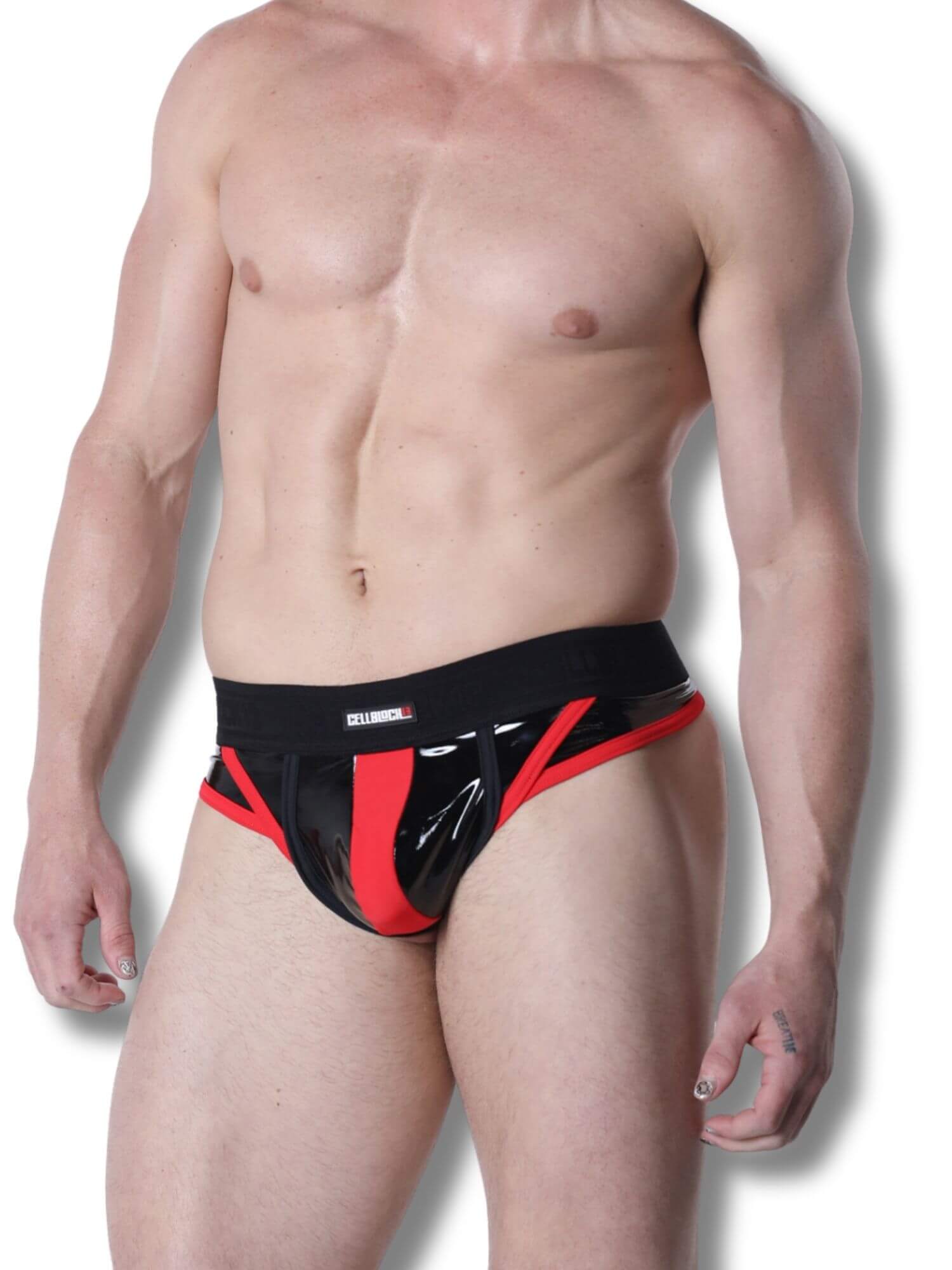 Man wearing a black and red thong on a white background