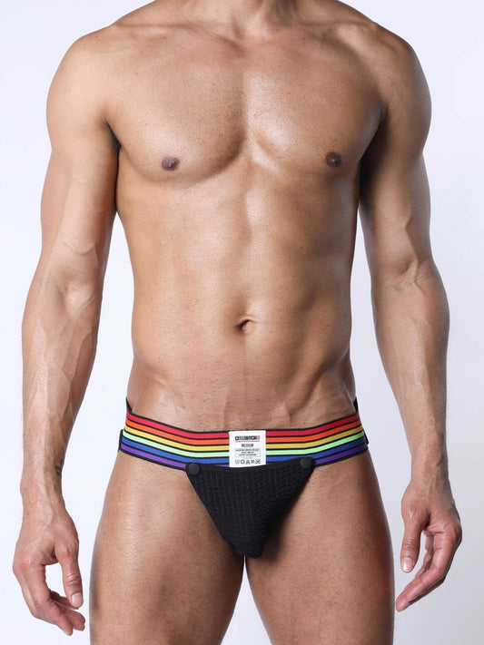 Man wearing a black jockstrap with rainbow trim on a white background