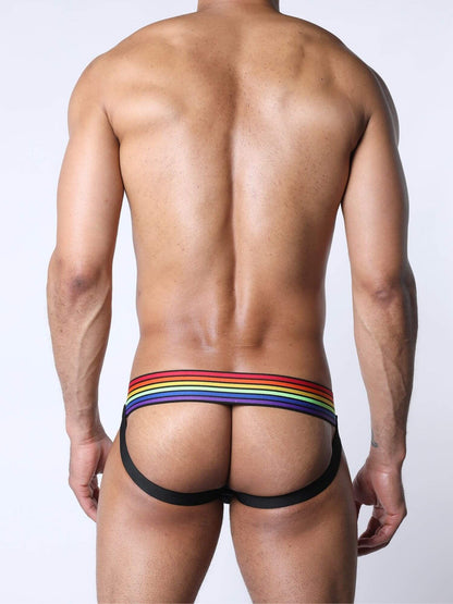 Man wearing a colorful rainbow jock against a plain background