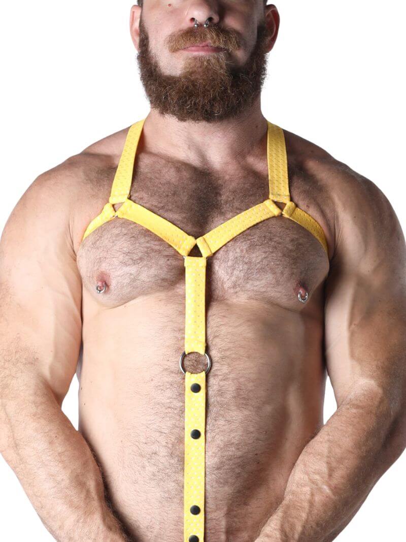 Man wearing a yellow harness on a white background