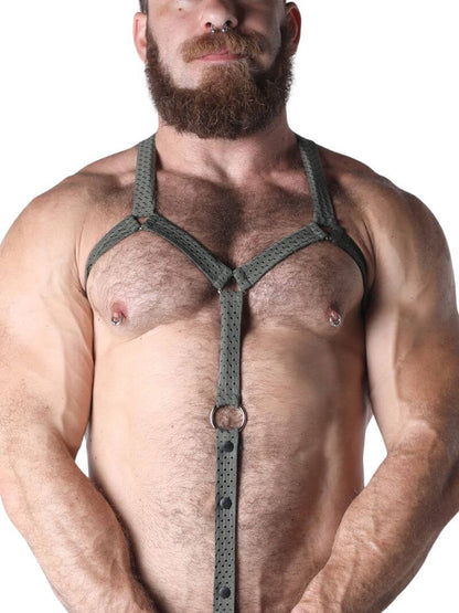 Man wearing a green harness against a white background