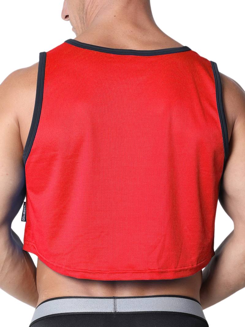 Red athletic tank top worn by a person on a white background