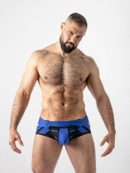 Man wearing blue and black underwear on a white background