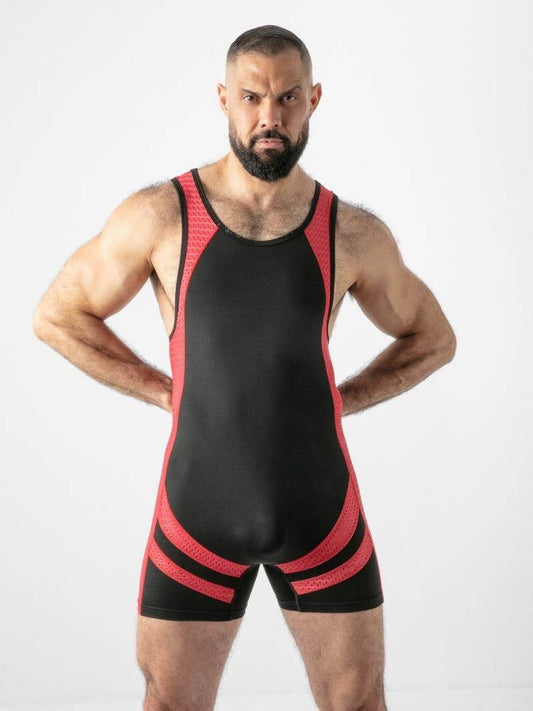 Man wearing a black and red wrestling singlet on a white background