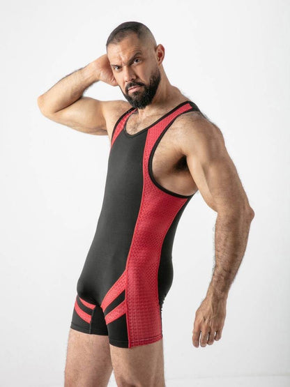 Man wearing a black and red wrestling singlet on a white background
