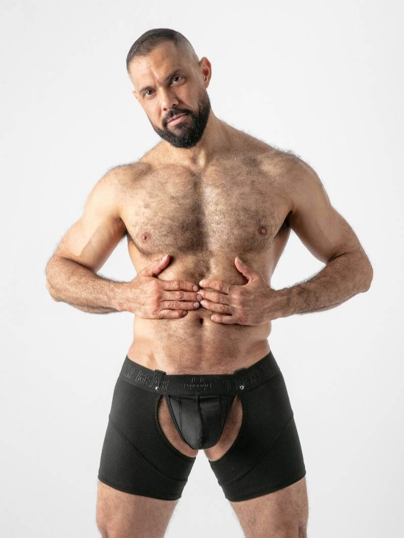Man wearing black underwear on a white background