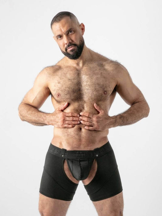 Man wearing black underwear on a white background