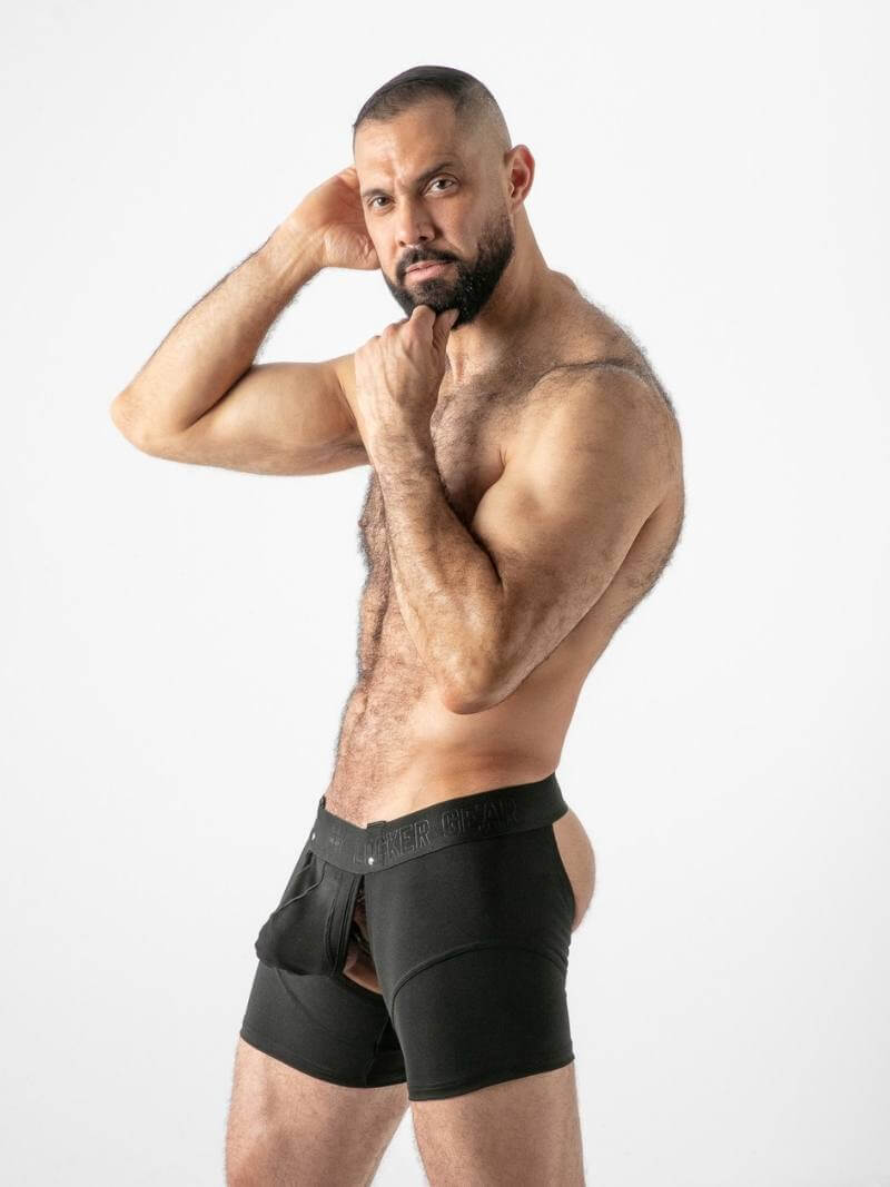 Man wearing black boxer briefs on a white background
