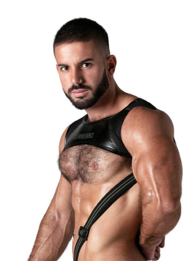 Man wearing a black harness against a white background