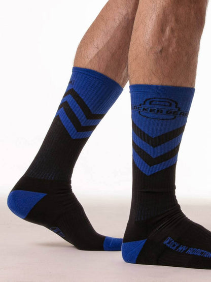 Black and blue socks with a zigzag pattern on a white background