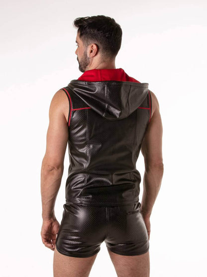 Gay guy wearing a black leather sleeveless hoodie with red accents on a white background