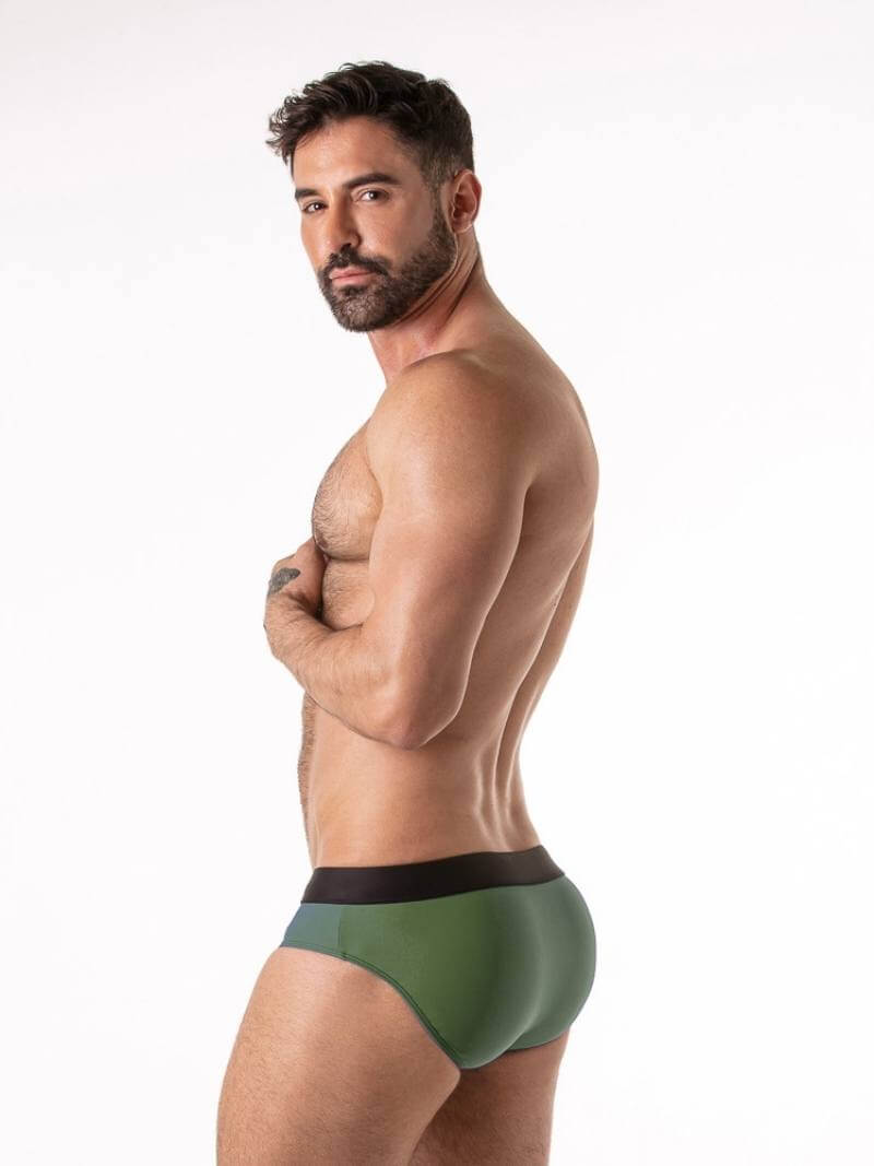 Man wearing green underwear with a white background