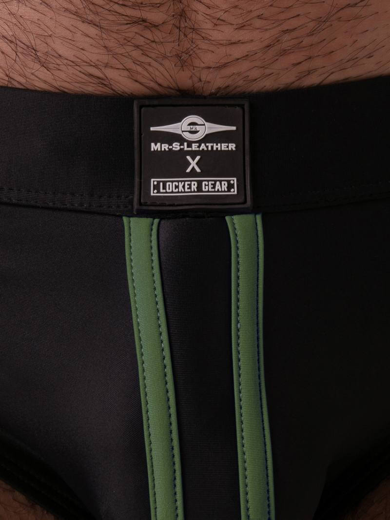 Close-up of a black leather belt with a visible brand label on a wooden surface.