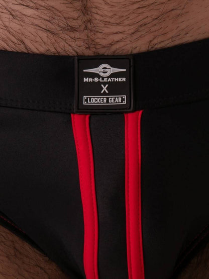 Black underwear with red stripes and a visible brand label on a skin background