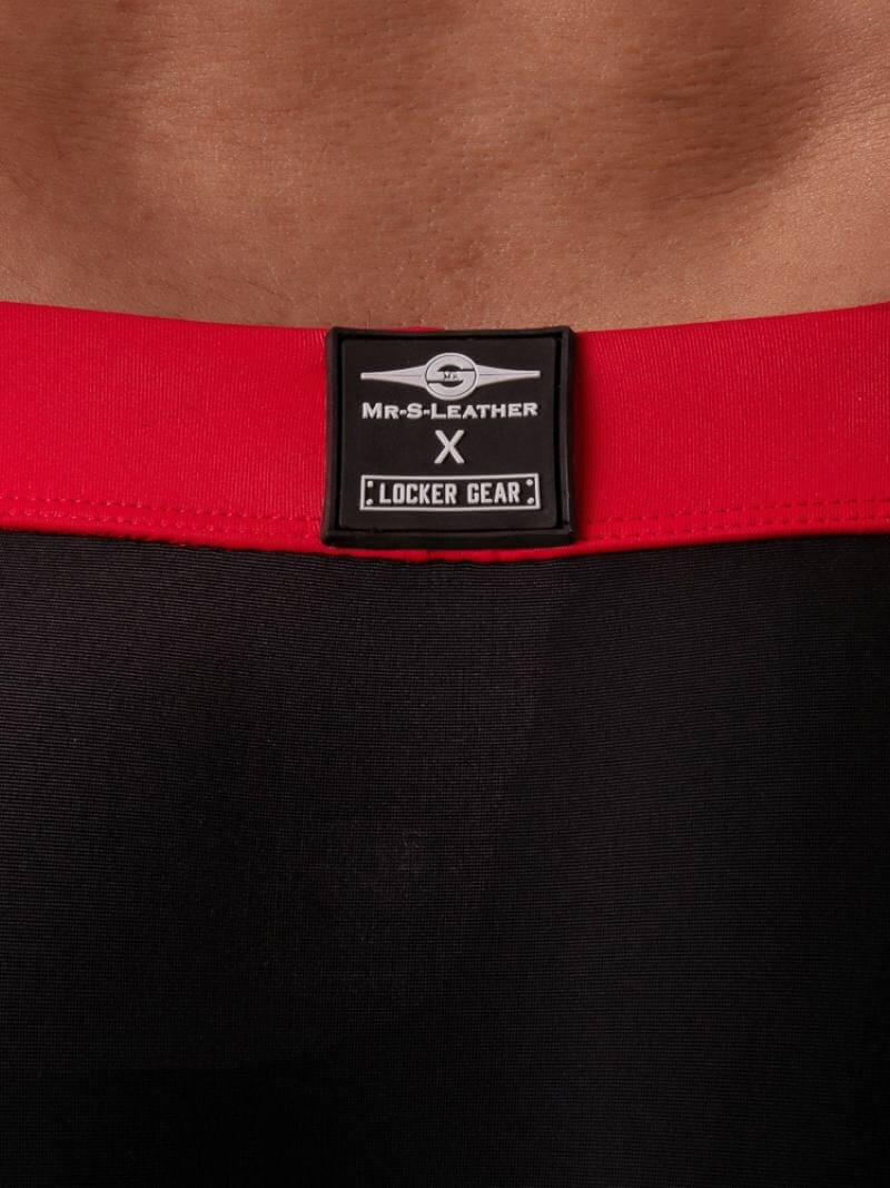 Red belt with a black label on a black background