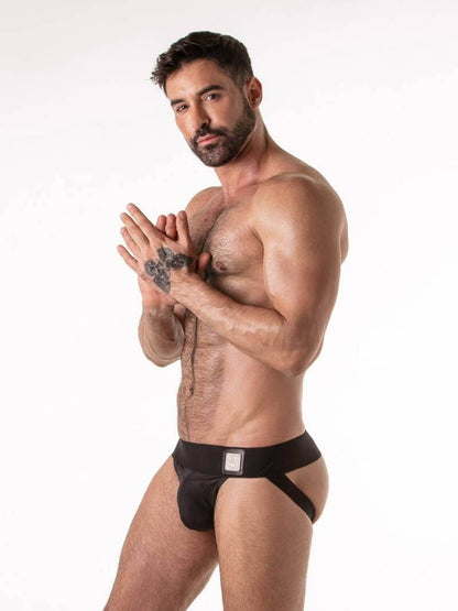 Man wearing a black men's gay jockstrap underwear on a white background