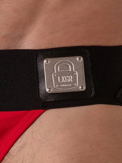 Black belt with a metallic 'LKCR' logo on a person's waist.