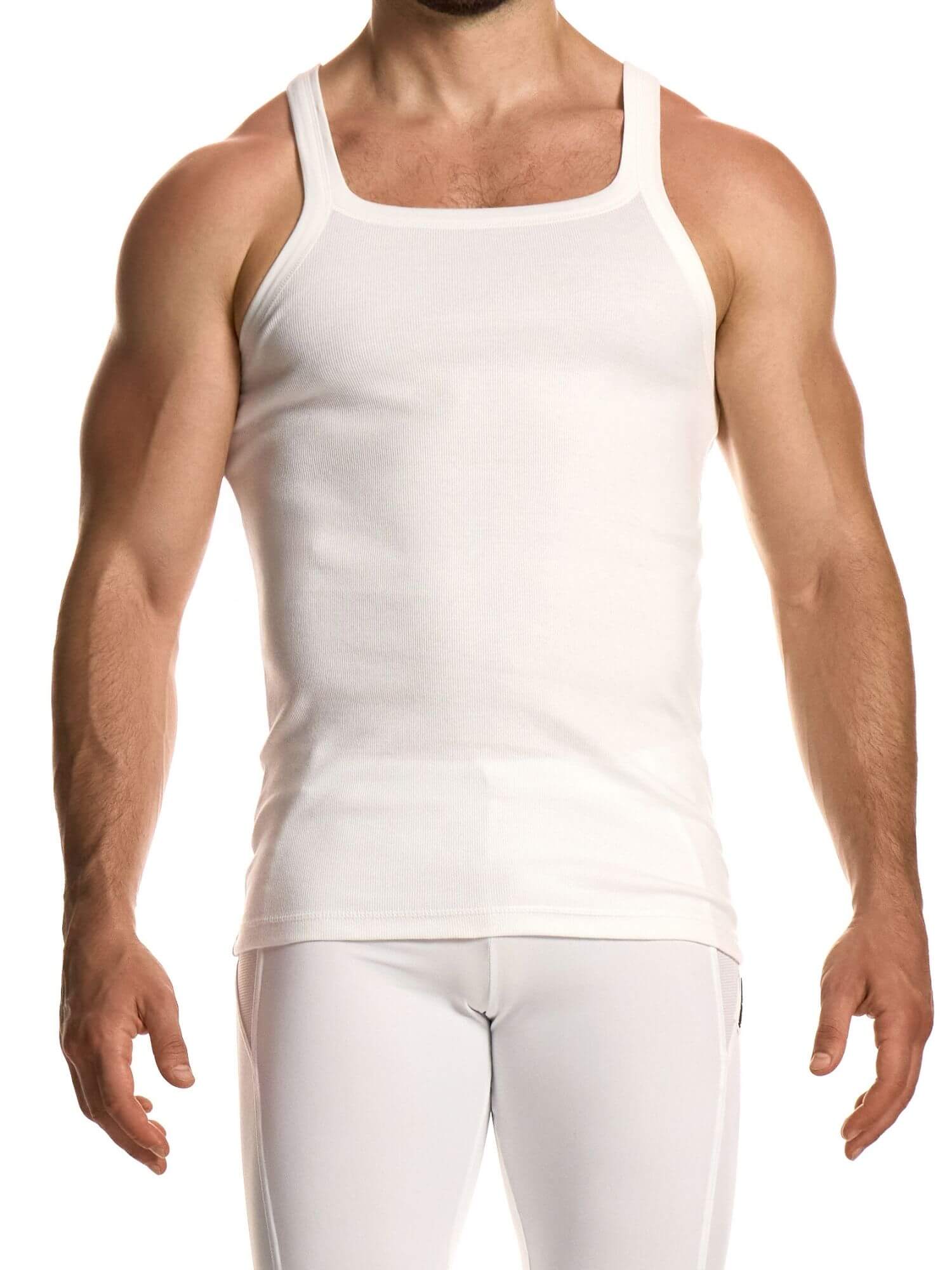 Person wearing a plain white tank top and pants on a white background