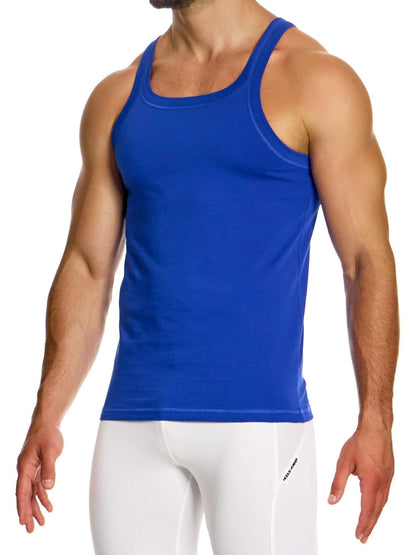Person wearing a blue tank top and white pants on a white background