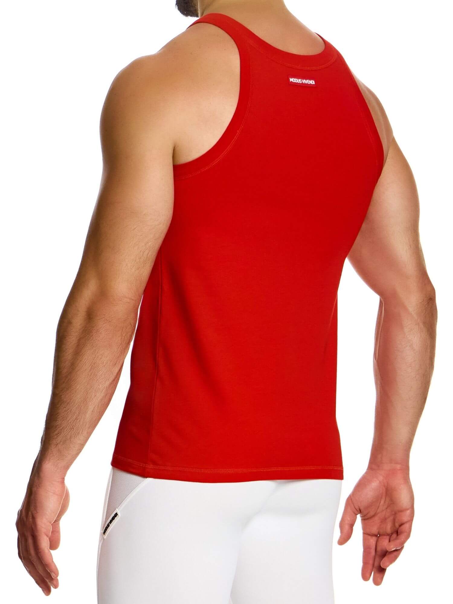 Red tank top worn by a person on a white background