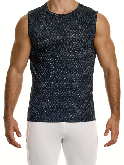 Man wearing a black patterned sleeveless shirt and white pants on a white background