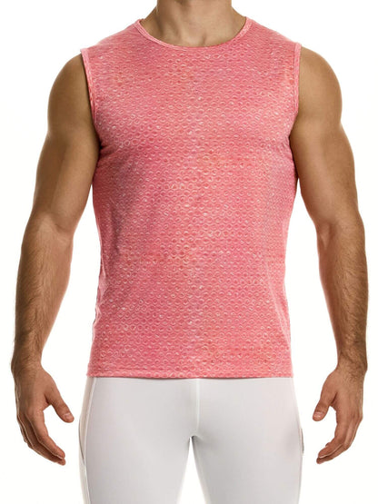 Man wearing a pink sleeveless shirt and white pants on a white background
