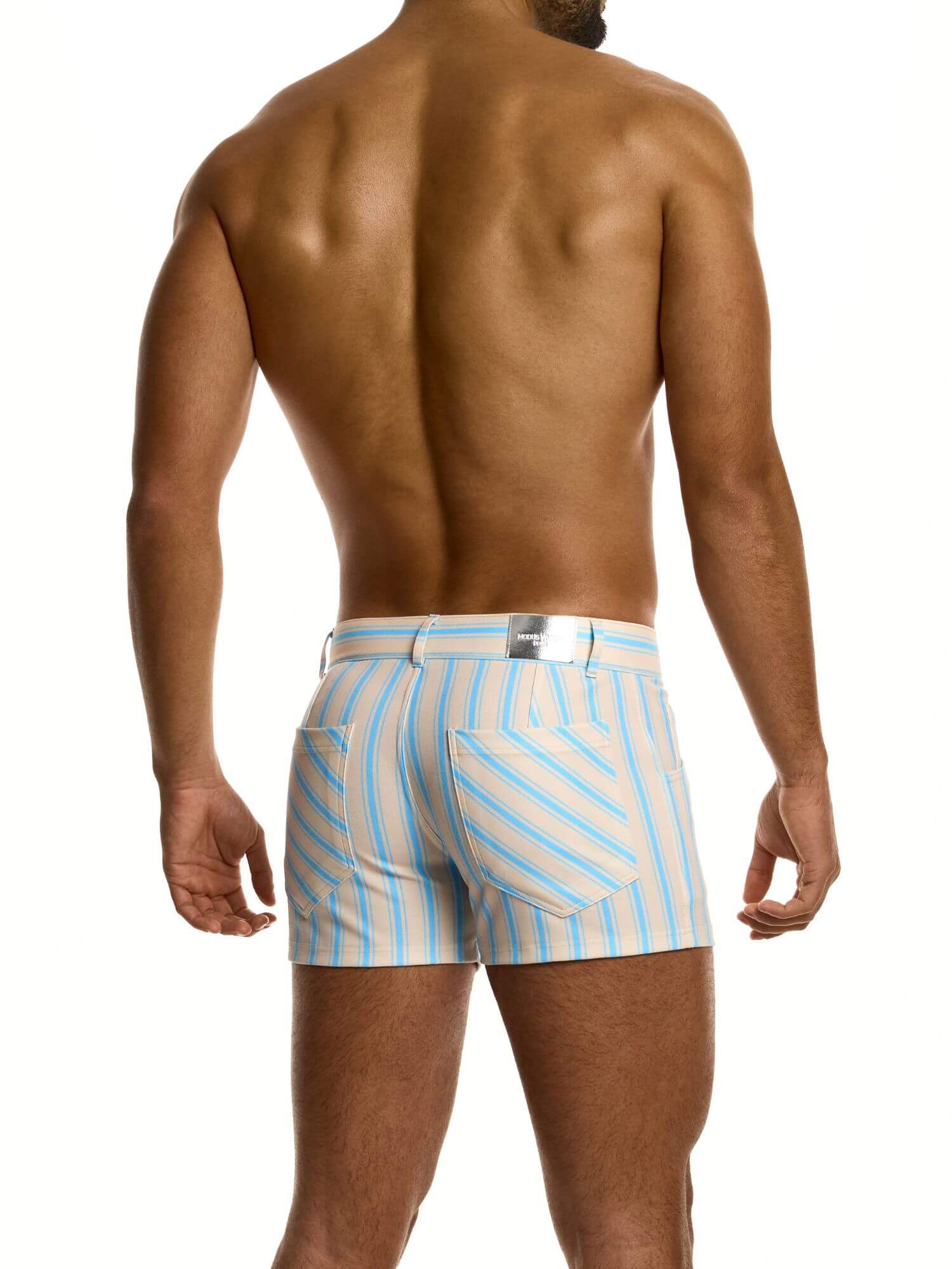 Man wearing beige and light blue striped shorts on a white background