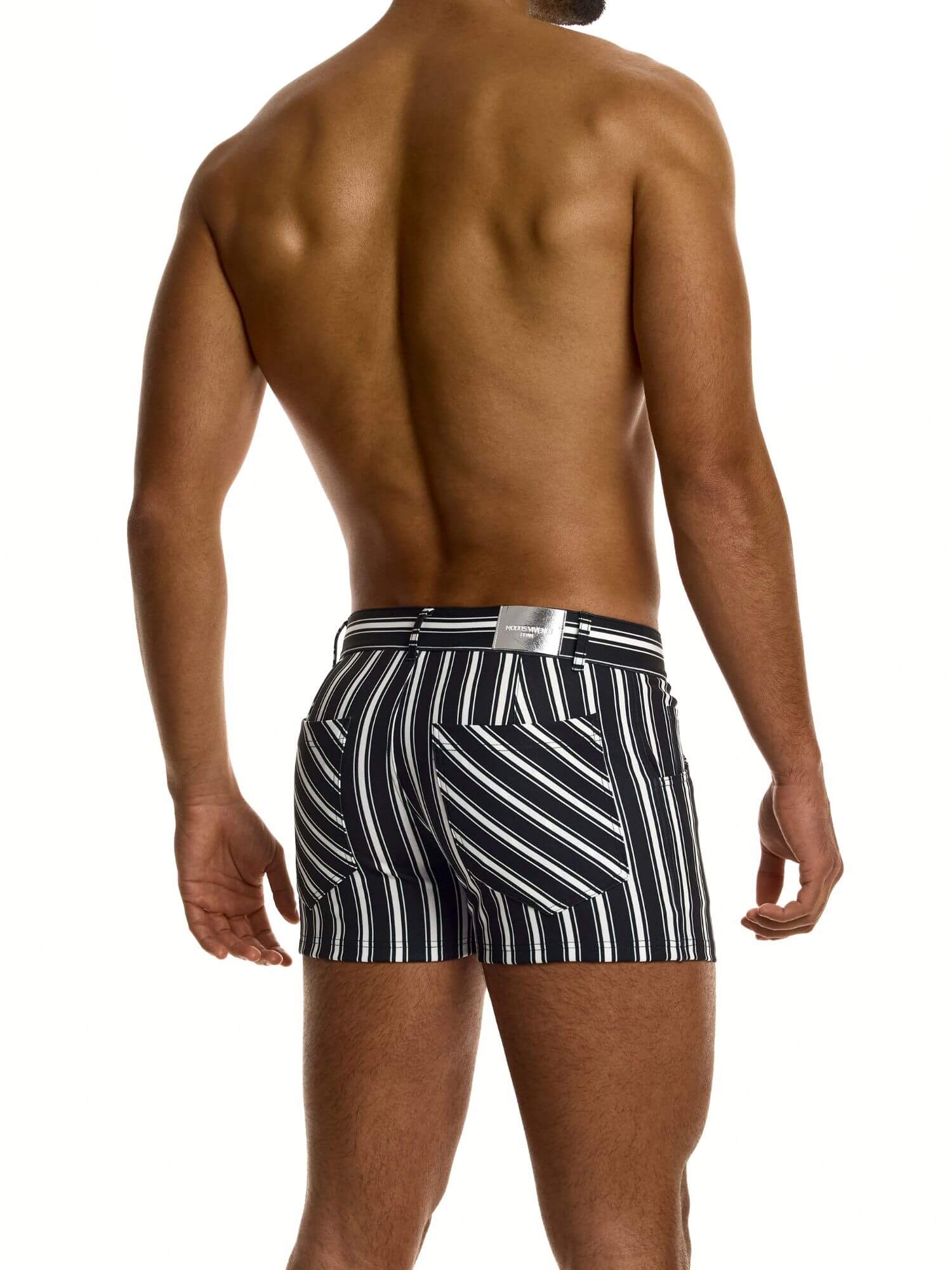 Man wearing black and white striped  shorts on a white background