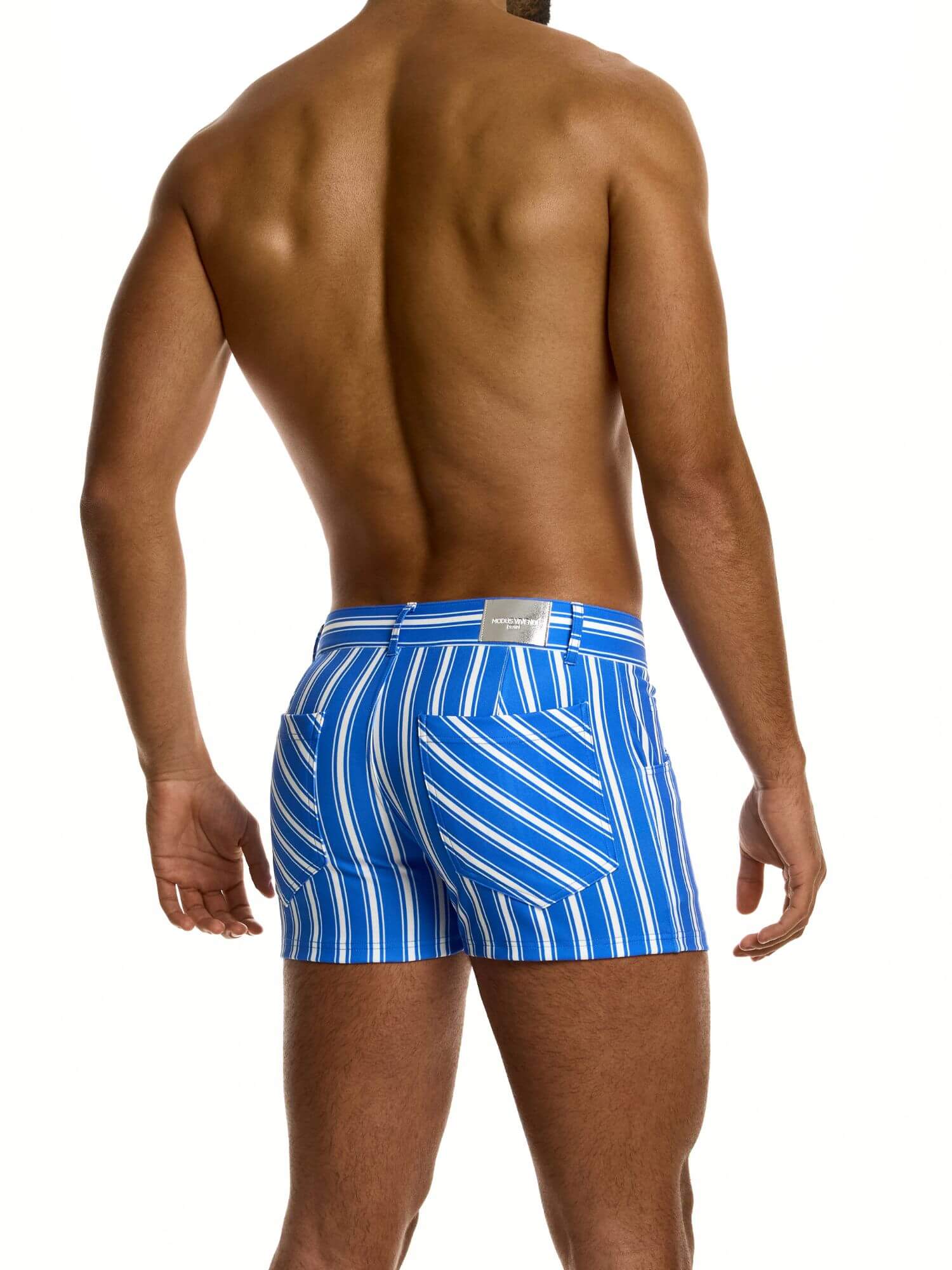 Man wearing blue and white striped shorts on a white background