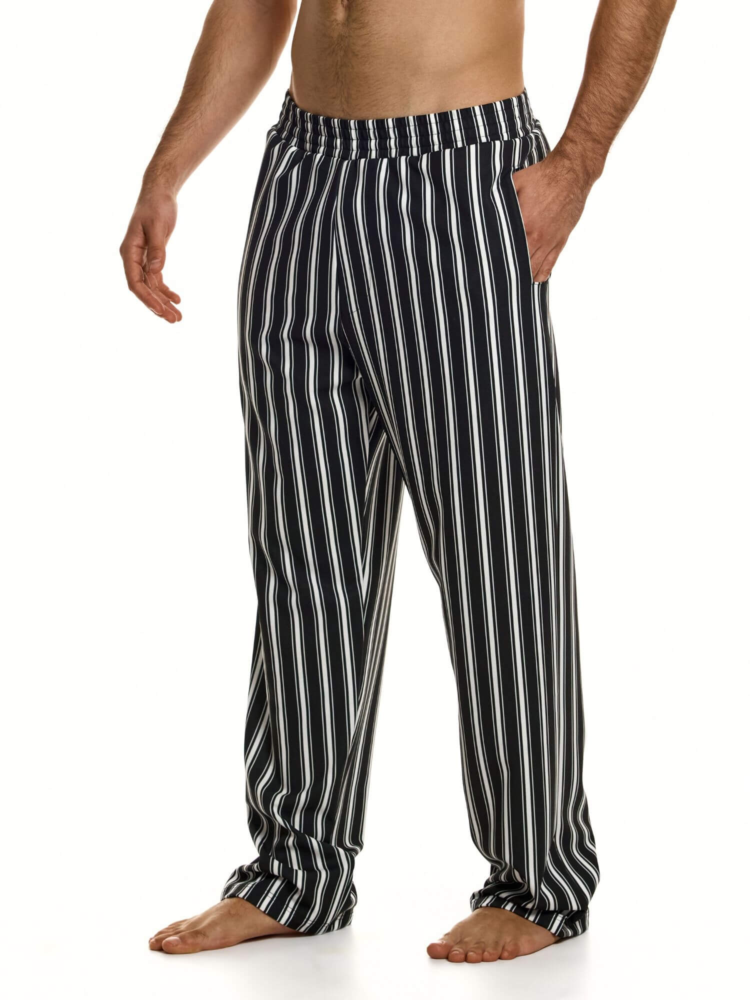 Black and white striped pants worn by a person on a white background
