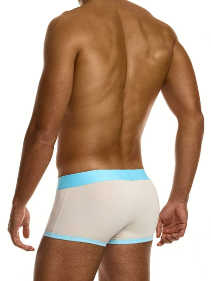 Man wearing beige underwear with a light blue waistband on a white background